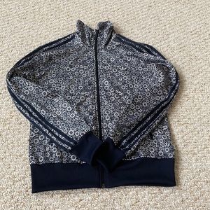 black and white adidas full zip jacket with stripes on the arms